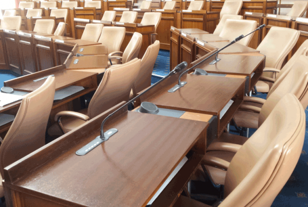 Desks in a row with in-built conference system