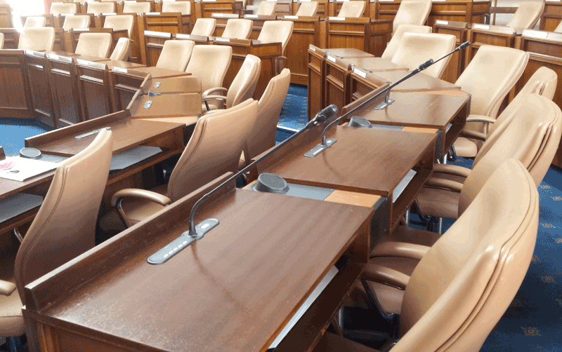 Desks in a row with in-built conference system