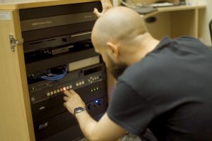 public-i AV engineer setting up a FX800 system