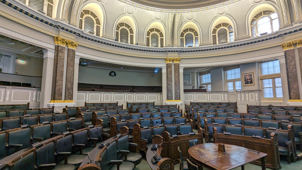 Birmingham room with microphones and projectors at the back